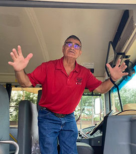 Bus driver standing in the bus
