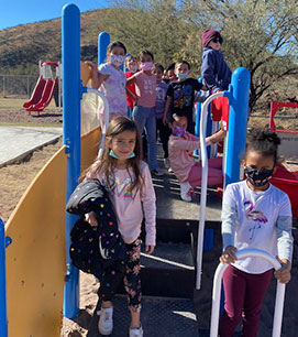 Students standing on the playground